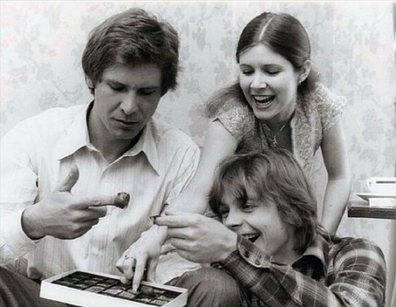 Star wars characters on set enjoying a box of See's candies