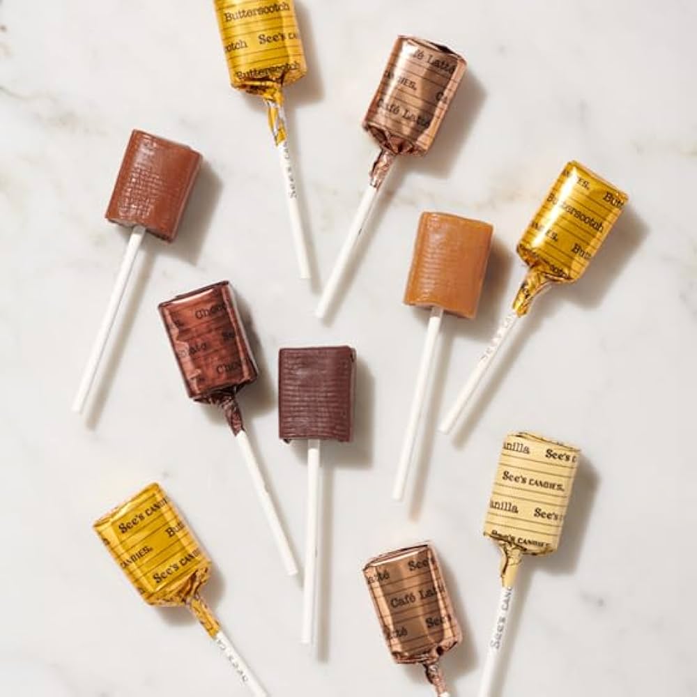 Chocolate lollipops with vintage-style packaging on a white background