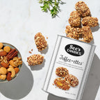 See's Candies Toffee-ettes with a bowl of nuts on a light background