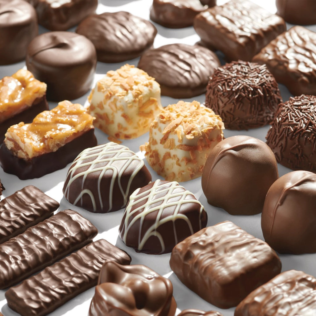 Assorted chocolate candies on a white background