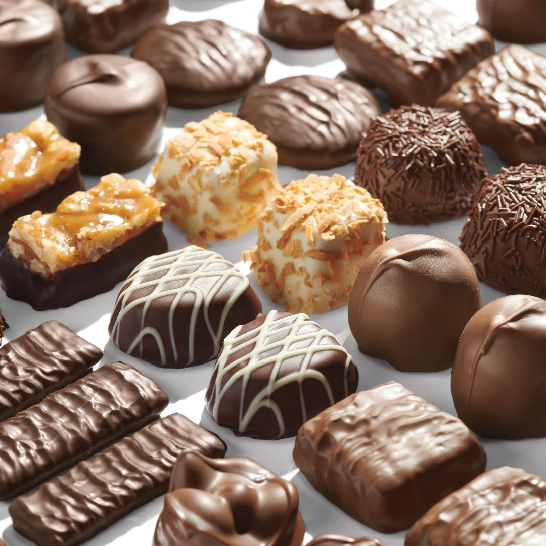 Assorted chocolate candies on a white background