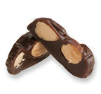 Almond royal cut in half on white background