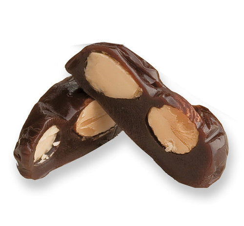 Almond royal cut in half on white background