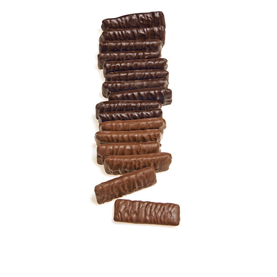 Stack of chocolate molasses chips on a white background
