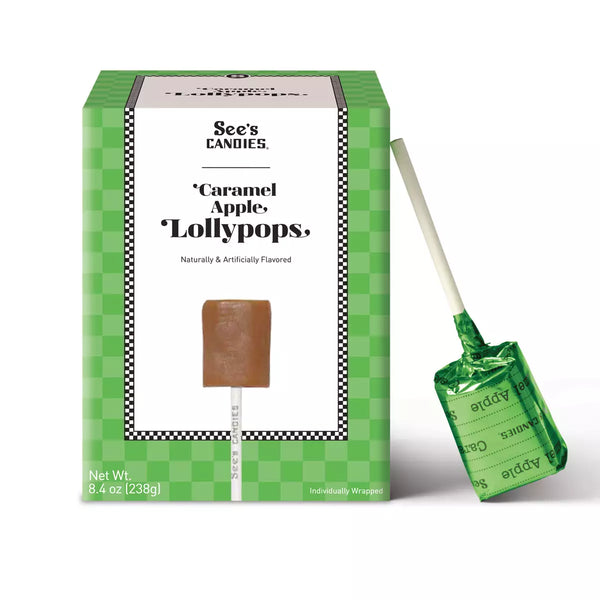 See's Candies Caramel Apple Lollipops in a green checkered box with one individually wrapped lollipop standing beside it on a white background.