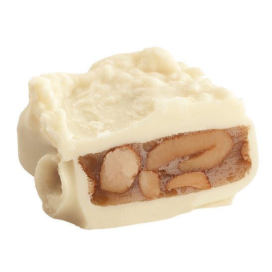 See's cashew brittle white chocolate half on white background