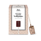 Box of See's Candies Chocolate Coconut Lollypops with a lollipop attached.