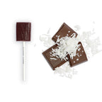 Chocolate lollipop and bars with coconut flakes on a white background