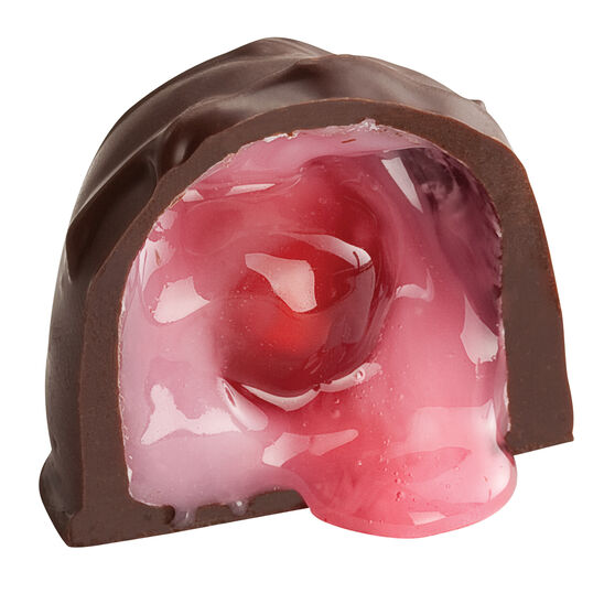 See's Dark Chocolate cherry cordial candy with a pink cherry center on a white background