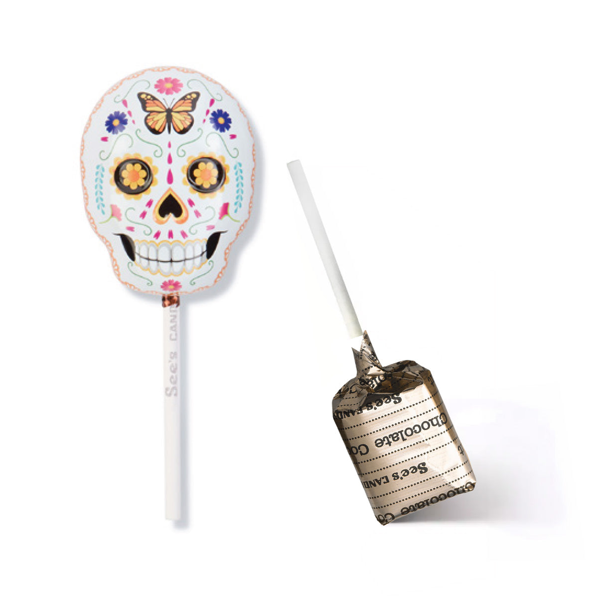A sugar skull lollipop tin shown on a white background, with one lollipop upright displaying the decorated skull design and the other lying on its side showing the chocolate coconut lollypop with wrapper with 'See's Candies' text.