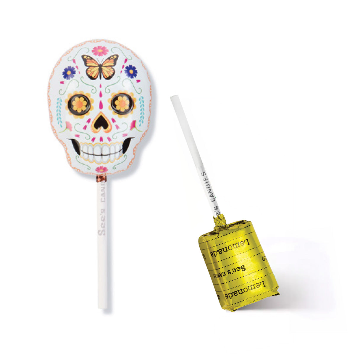 A sugar skull lollipop tin shown on a white background, with one lollipop upright displaying the decorated skull design and the other lying on its side showing the yellow lemonade lollypop with wrapper with 'See's Candies' text.