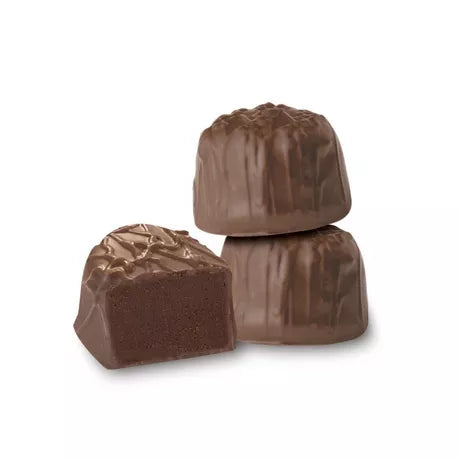 Three milk chocolate candies on a white background