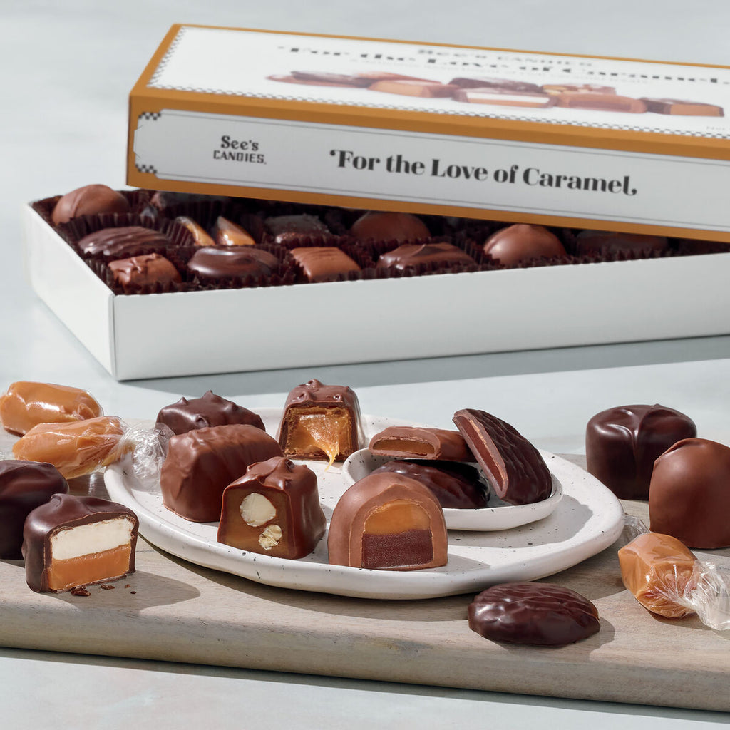 Assorted caramel candies on a white plate with a See's Candies box in the background.