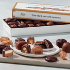 Assorted caramel candies on a white plate with a See's Candies box in the background.