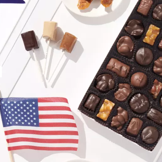 July 4th red white blue product layouts with american flag nuts and chews lollypops on white table