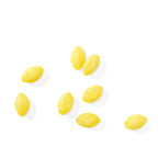 Yellow lemon drops loose on white background