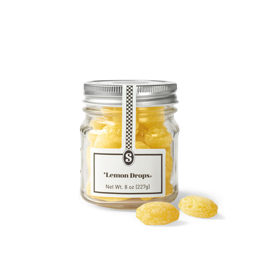 Jar of lemon drops with a label on a white background