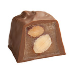 See's milk almond caramel half on white background