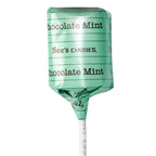 A single lollipop wrapped in shiny mint-green foil with 'Chocolate Mint' and 'See's CANDIES.' printed on the wrapper, shown on a white stick against a plain white background.