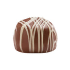 A single round chocolate confection, likely a truffle or praline, coated in smooth milk chocolate with a decorative drizzle of white chocolate on top, isolated on a white background.