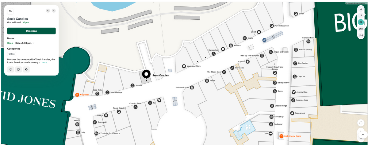 A digital map interface showing a location pin over 'See's Candles' in a retail Robina Town Centres shopping district.