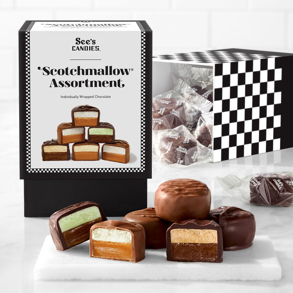 Assortment of See's Candies Scotchmallow chocolates with packaging on a white background