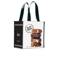 Tote bag with See's Candies logo and a stack of fudge bars on a white background