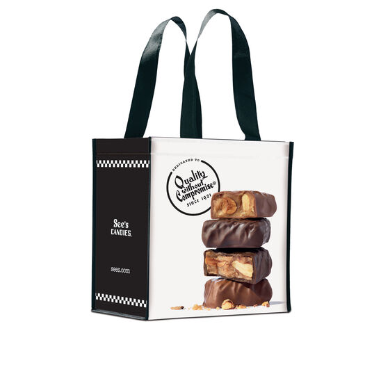 Tote bag with See's Candies logo and a stack of fudge bars on a white background