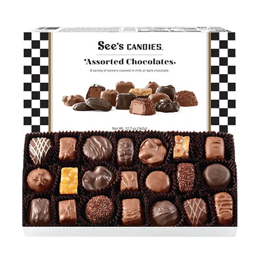 Box of See's Candies Assorted Chocolates open on white background
