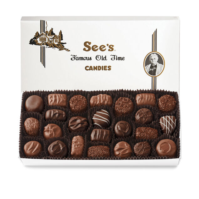 Box of See's Candies with a variety of soft center chocolates on a white background