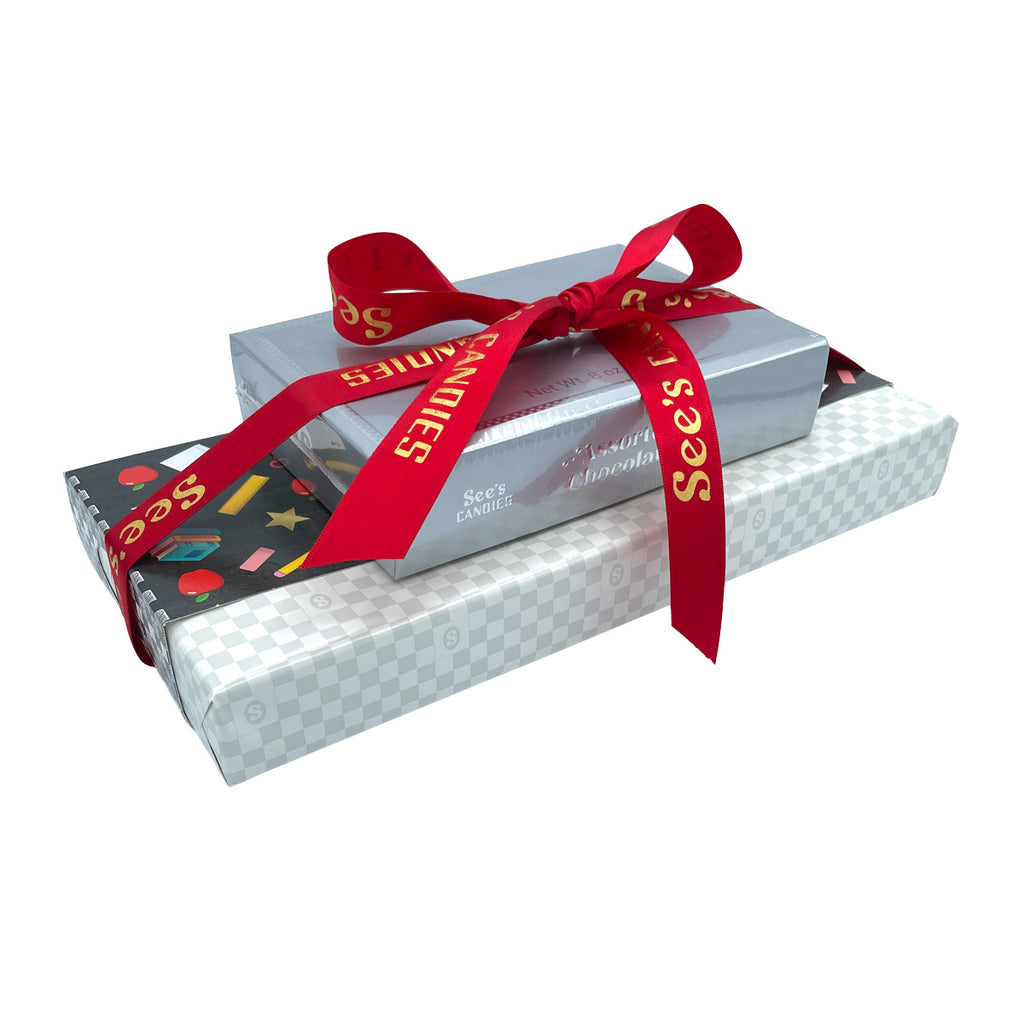 Silver gift box with a red ribbon on a white background