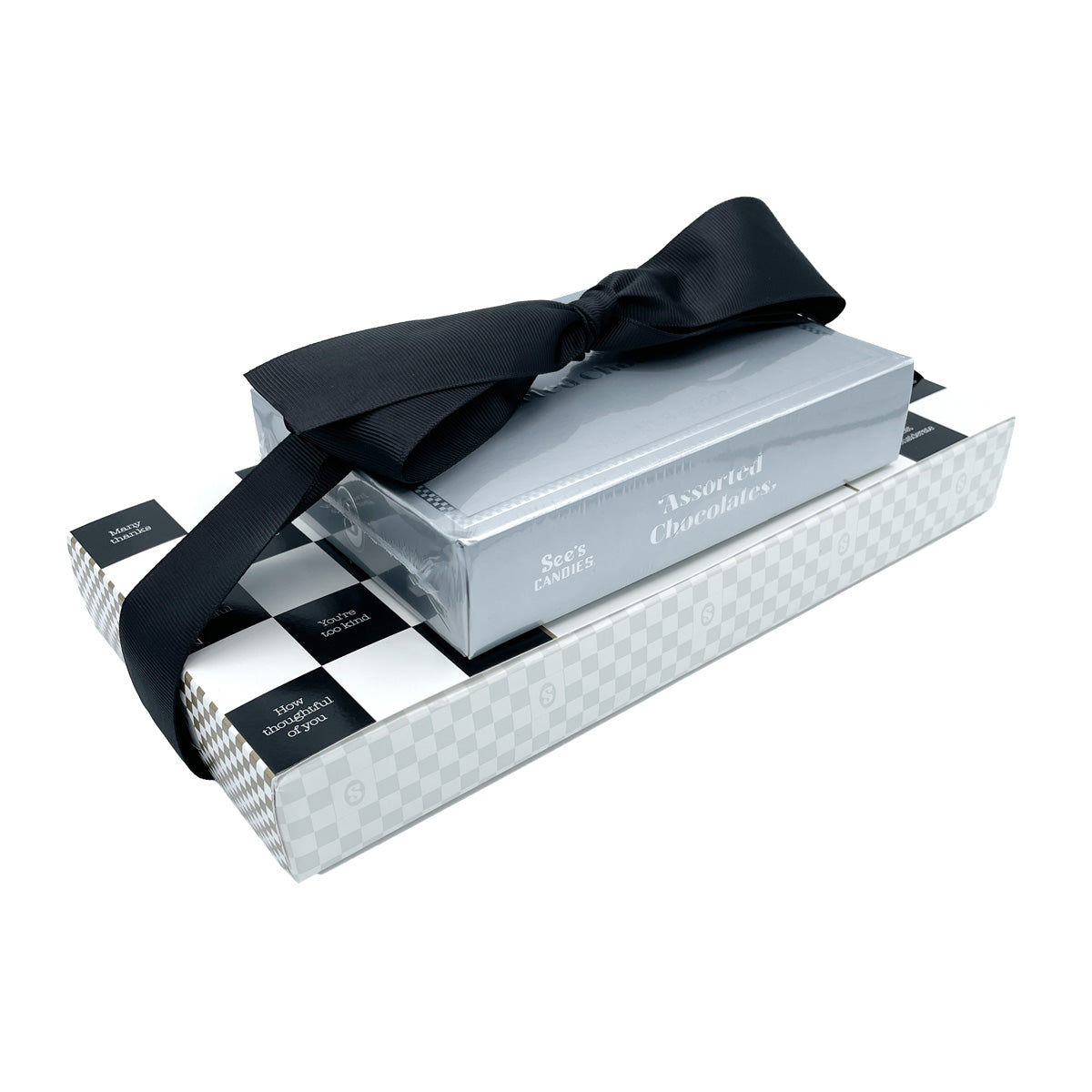 Set of See's chocolate boxes in a decorative box with a black ribbon on a white background