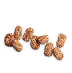 Loose See's toffee-ettes on white background